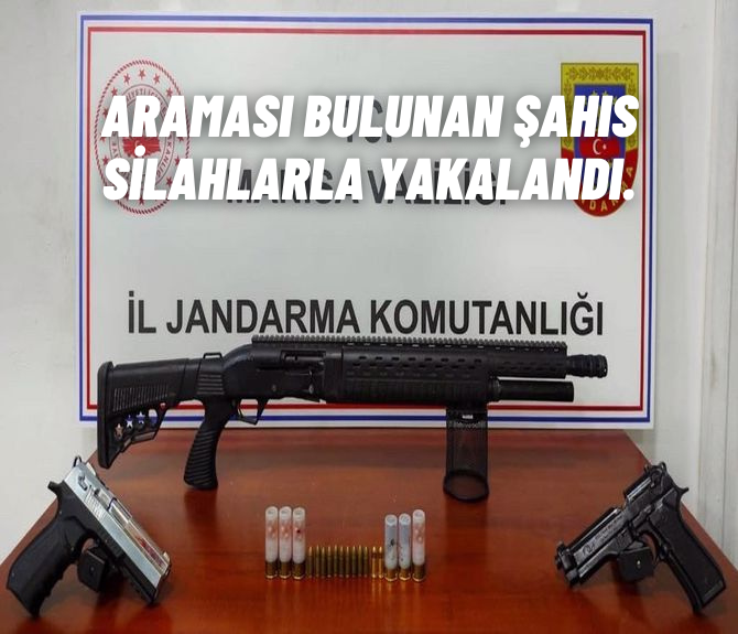 Araması bulunan şahıs silahlarla yakalandı
