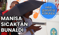 Manisalılar sıcaklardan şemsiyeye sığındı